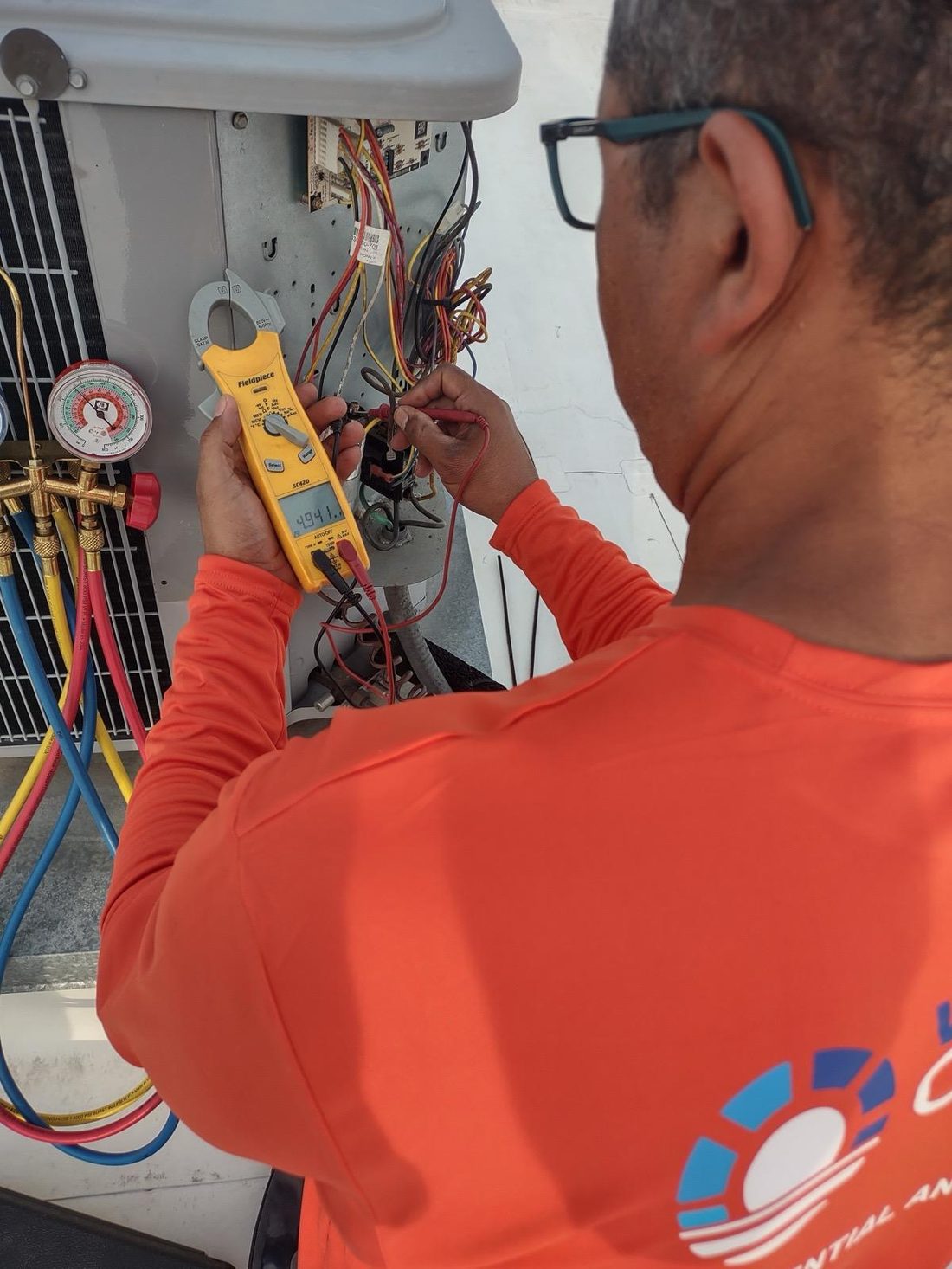 HVAC technician checking superheat and subcooling on a residential AC system in Winter Garden FL